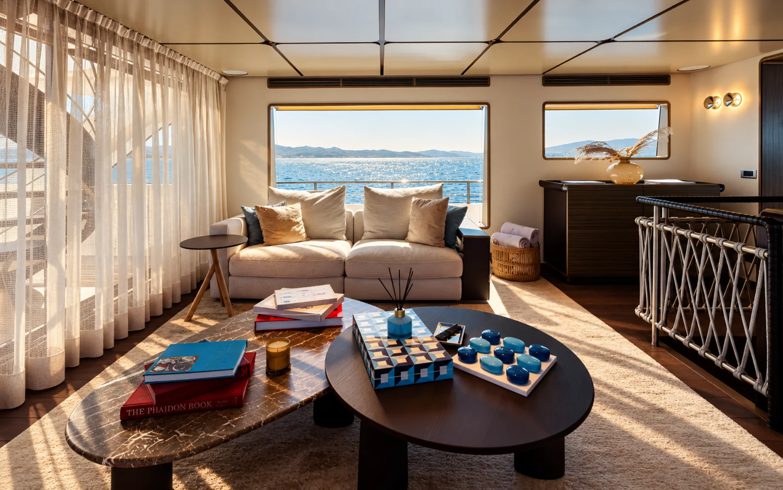 LAVAN's lounge, with a cream sofa, coffee tables and sea views
